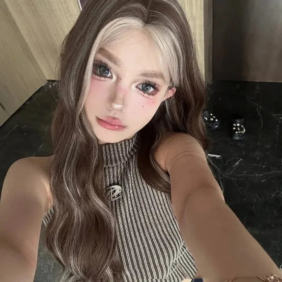 Long curly synthetic wig in grey gold colour with highlights and lace front.