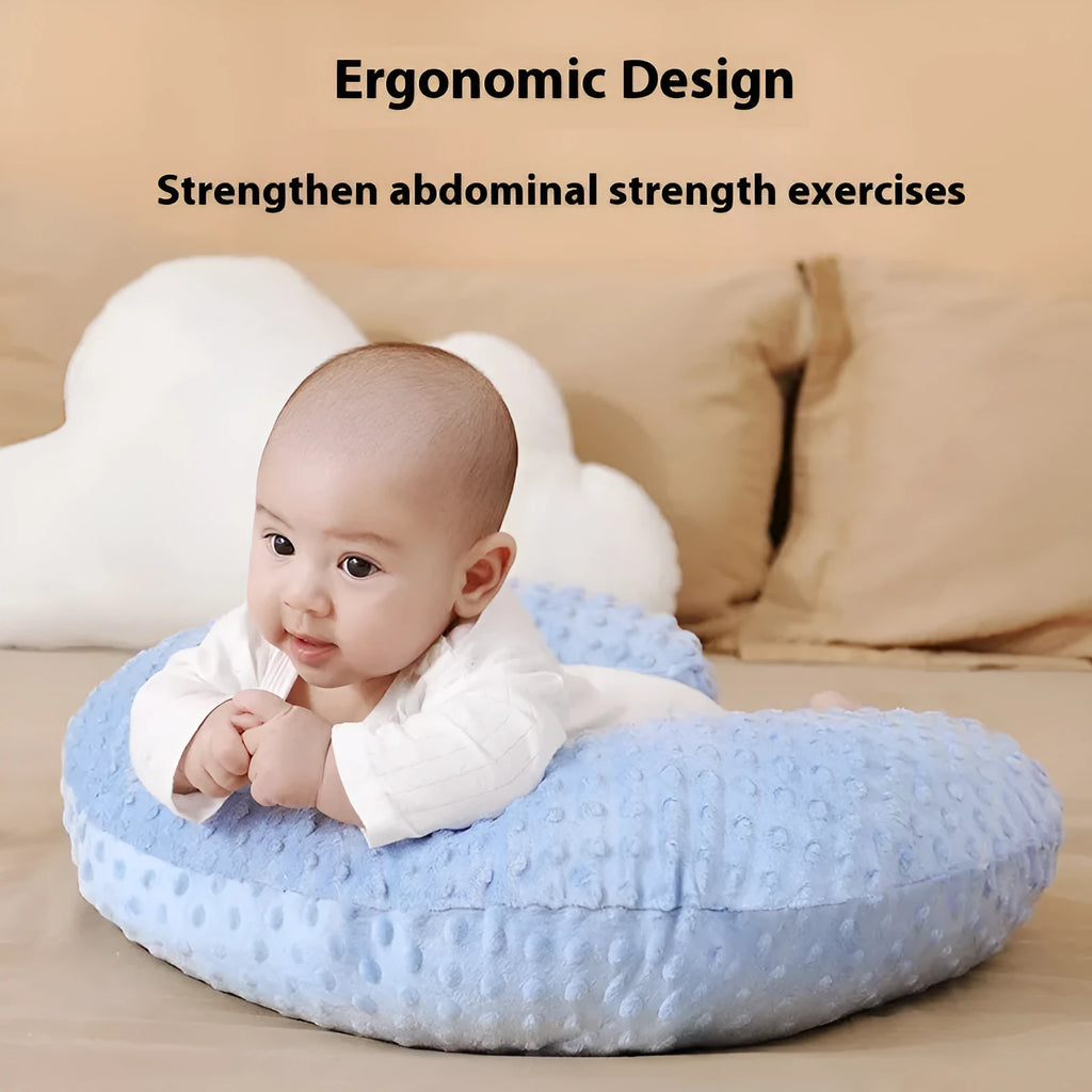 Multifunctional nursing pillow with a raised spill-prevention ridge in a light blue colour.