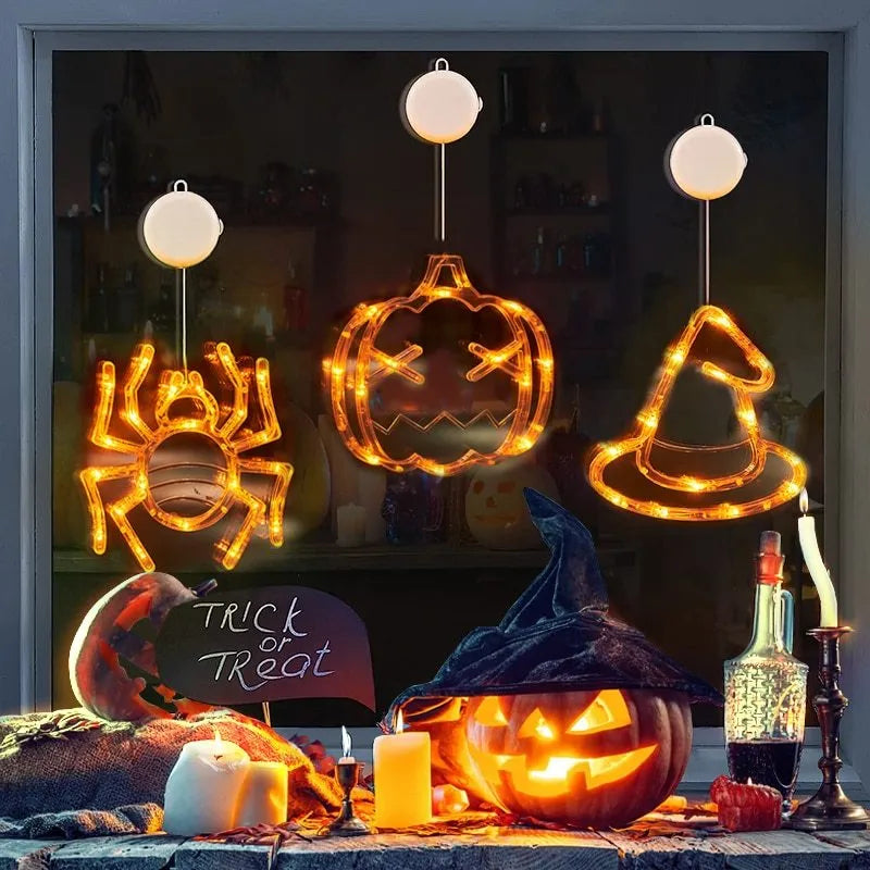 Halloween LED window lights with suction cups showing ghost, spider, and pumpkin decorations