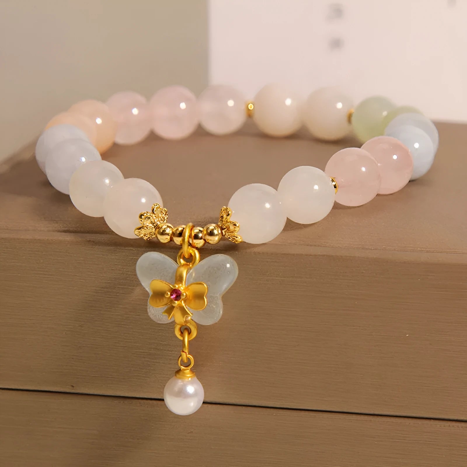 Women's morganite crystal bracelet with colourful butterfly pendant in original jewellery design