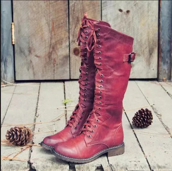 Black women's chunky heel high-leg casual boots with a round toe on a plain background.