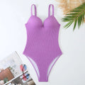 Women's sleeveless one-piece swimsuit in polyester fabric for swimming.