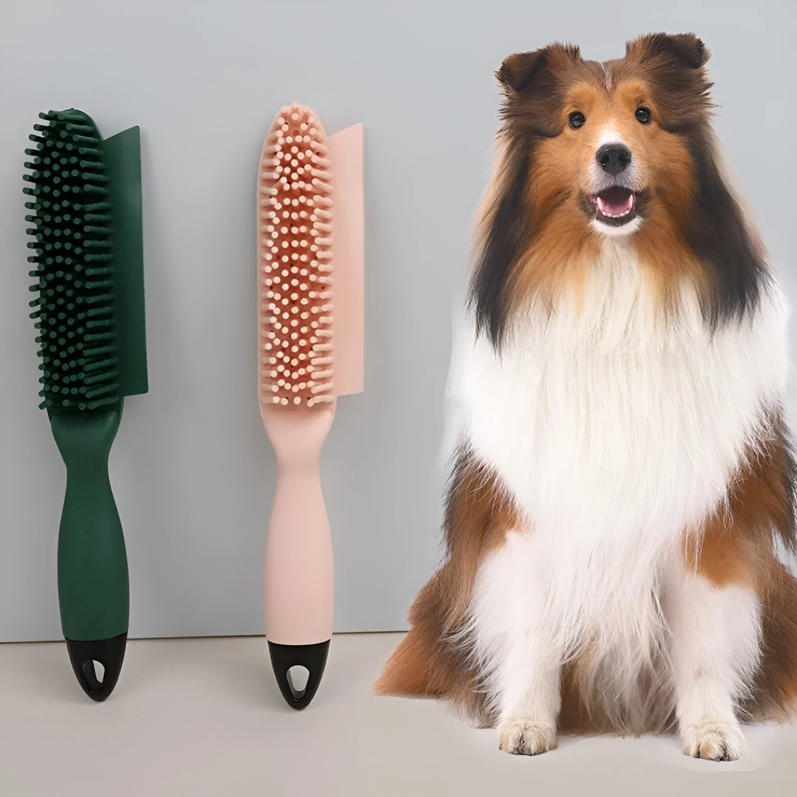 Pink and green handheld pet hair remover brush with grooming comb and integrated clothes hair collector.
