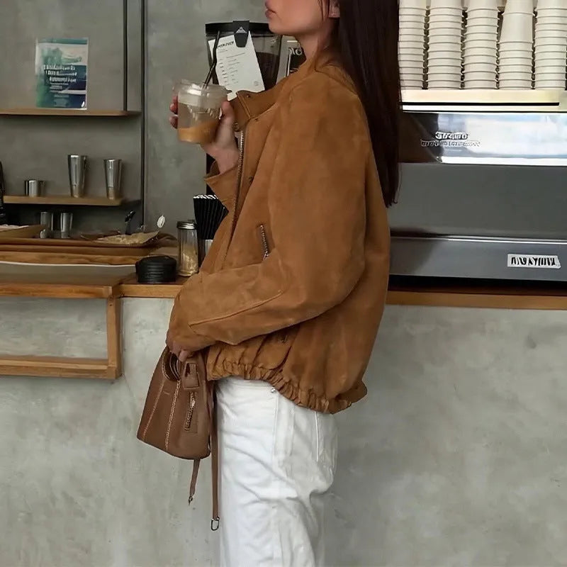 A loose-fitting solid colour long sleeve jacket on a white background.