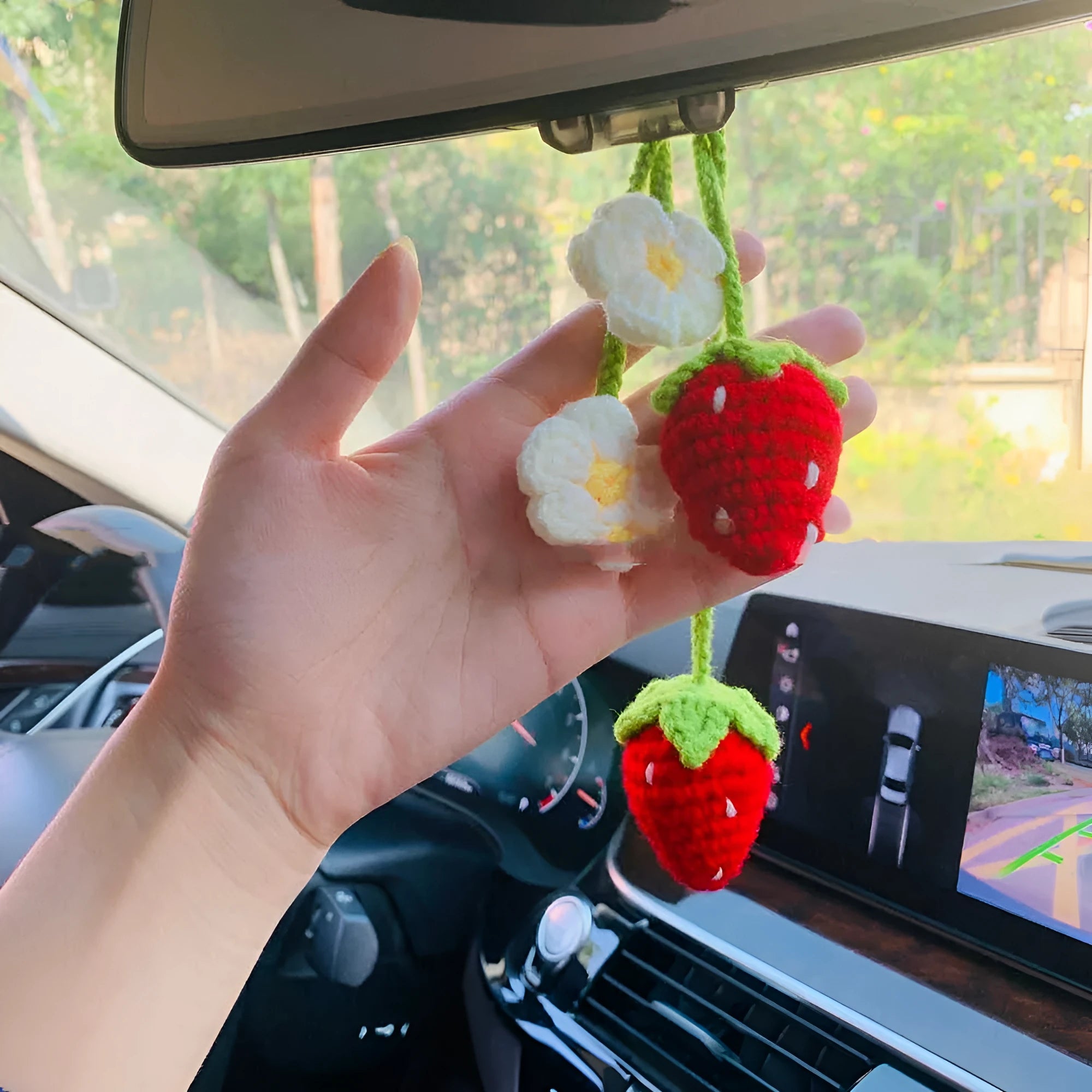 Handmade crochet strawberry-shaped car pendant made from cotton and hemp yarn.