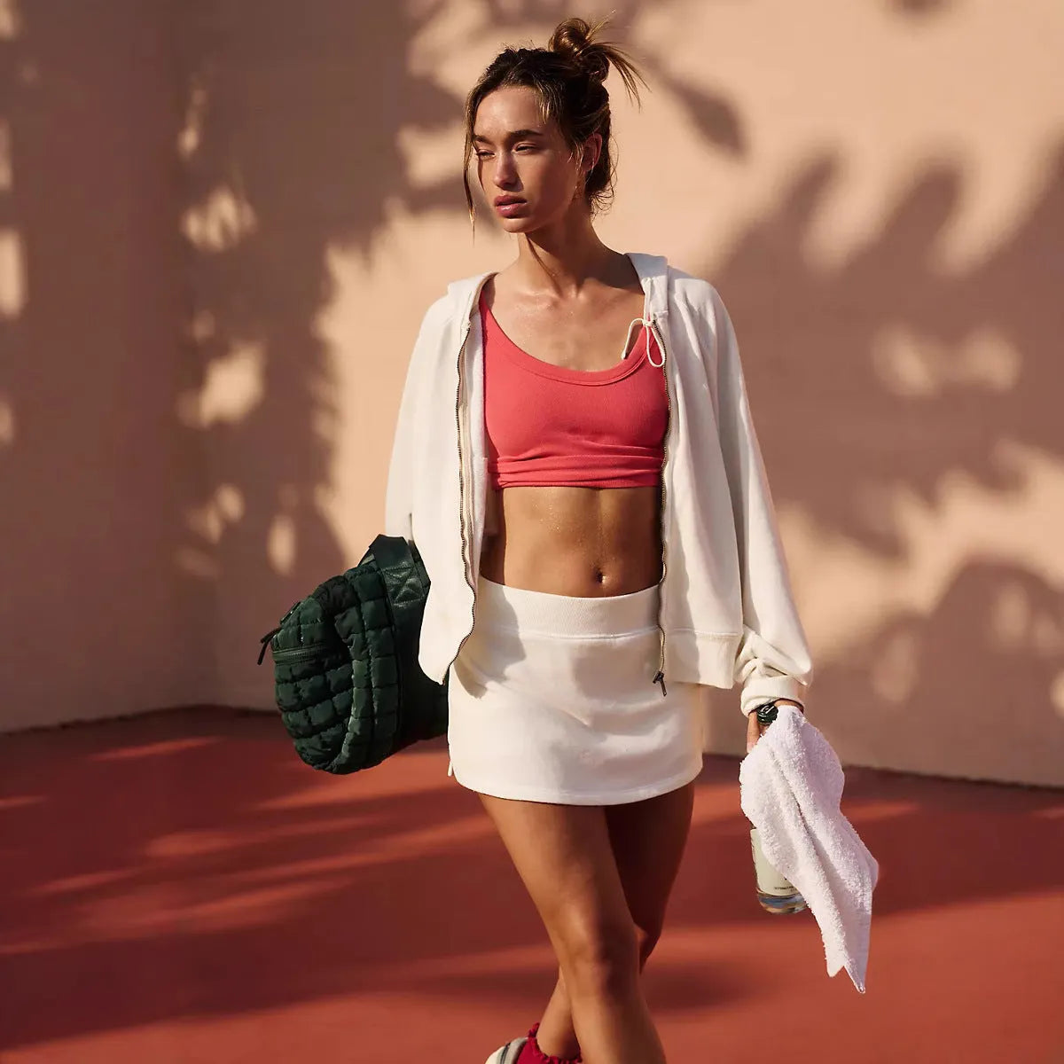 Women's blue hooded zip-up jacket and matching mini skirt streetwear outfit set on a hanger.