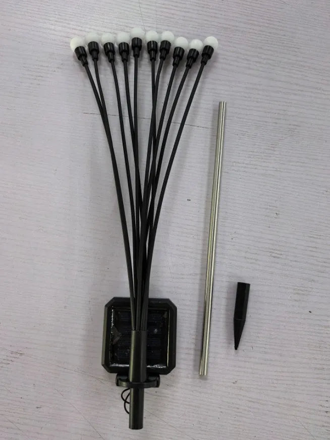 Solar-powered LED garden light with multiple heads on stainless steel ground spikes