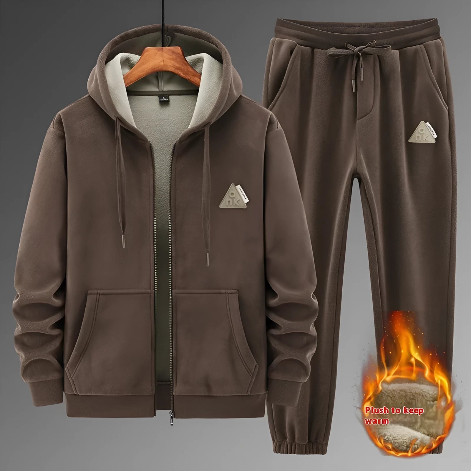 Man wearing a grey cashmere hooded sweater and matching cotton pants from a casual sports suit set.