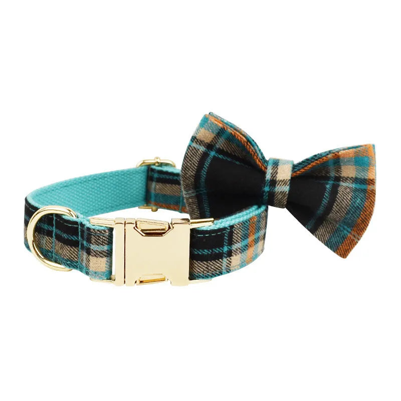Green retro style cloth dog collar, leash, vest, and decorative bow set laid out flat.