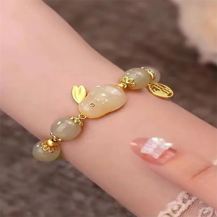 Green lucky jade hare bracelet for women with Chinese zodiac animal design and electroplated finish.