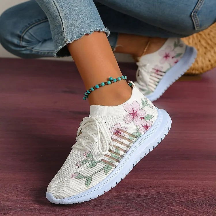 Women's Milky White mesh Flyknit running shoes with flat heel and round toe on a rubber sole.