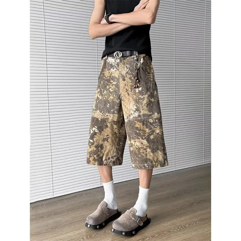 Yellow women's jeans with snake camouflage pattern and cropped leg length.