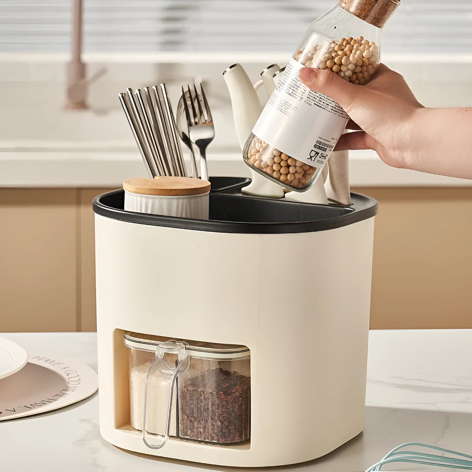 White rotating kitchen storage bucket with an integrated four-section spice box for cutlery and seasoning organisation.