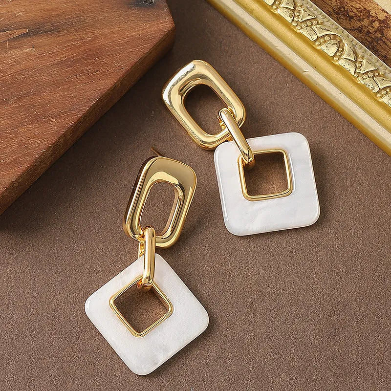Copper hollow geometric square earrings with chamfered corners in gold or blue electroplated finish