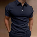 Man wearing a loose fit grey cotton blend t-shirt with short sleeves, showing the relaxed casual style.