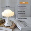 Small mushroom-shaped night lamp on a charging base in wood grain colour finish.