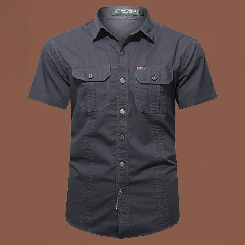 Man wearing a loose-fit army green short sleeve cotton work shirt with a cardigan style.