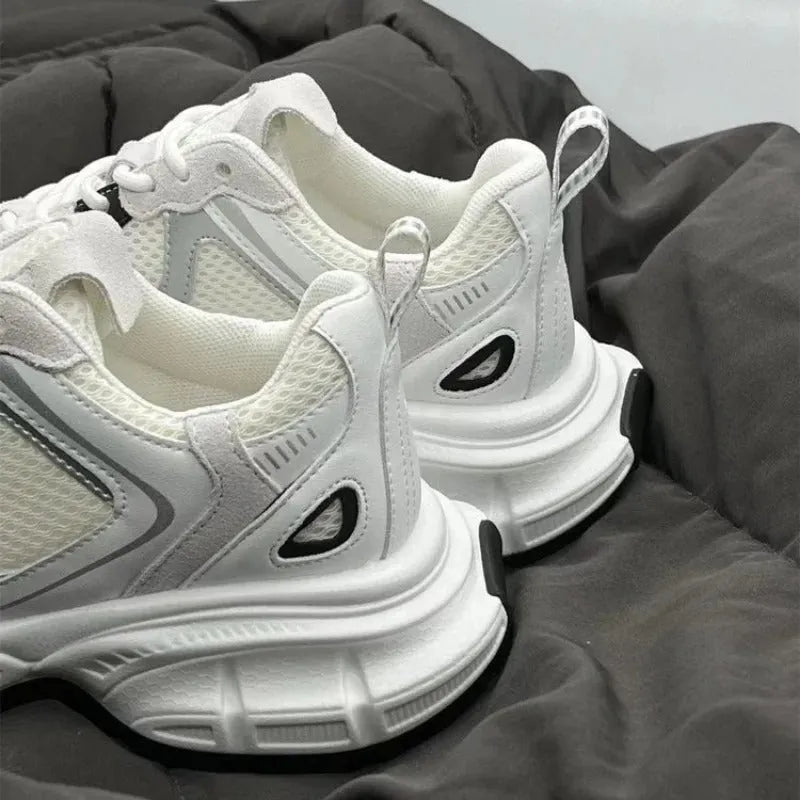 Beige mesh platform sports shoes with a wedge heel and front lace-up fastening.