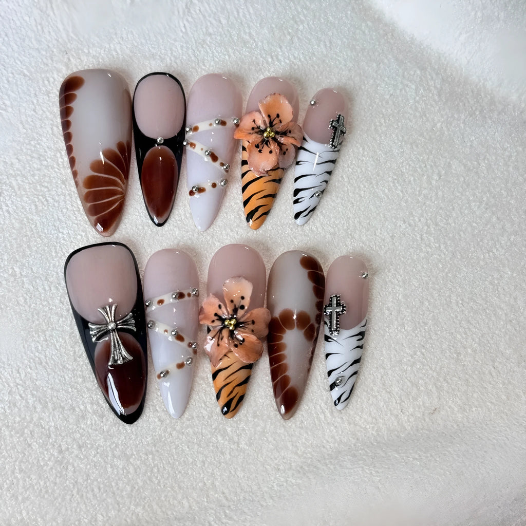 Handmade French style leopard print nail armour stickers with cross and flower patterns.