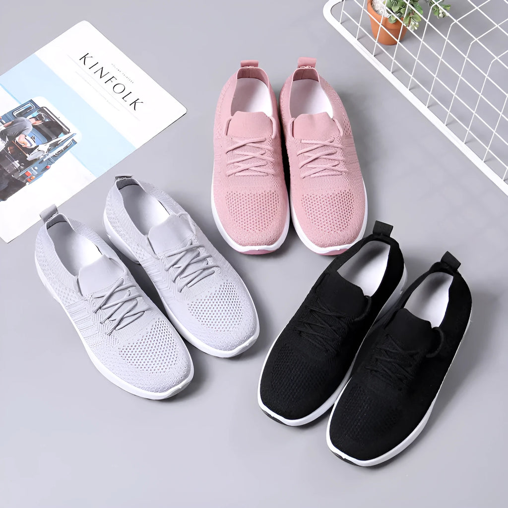 Women's black mesh casual sneakers with round toe and white lace-up front on a soft non-slip sole.
