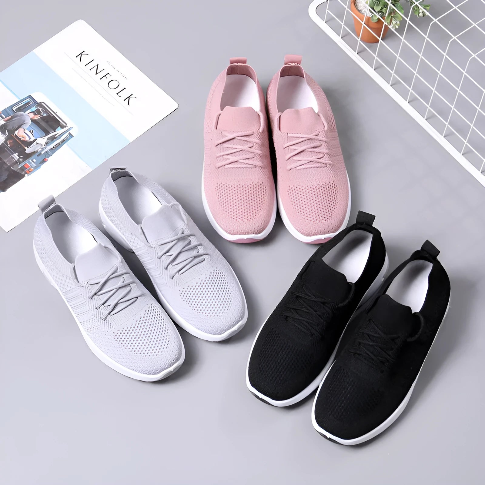 Women's black mesh casual sneakers with round toe and white lace-up front on a soft non-slip sole.