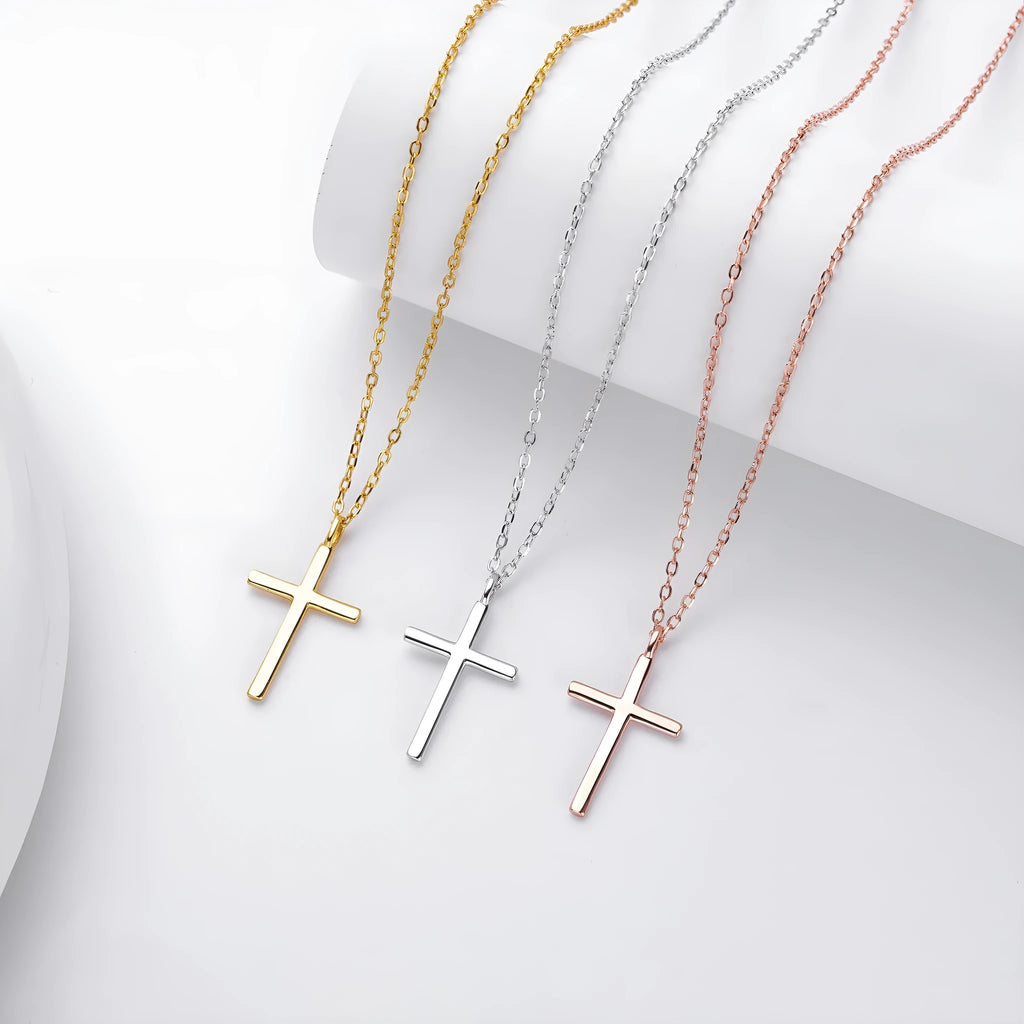 Simple glossy cross pendant on an adjustable O-shaped sterling silver chain.