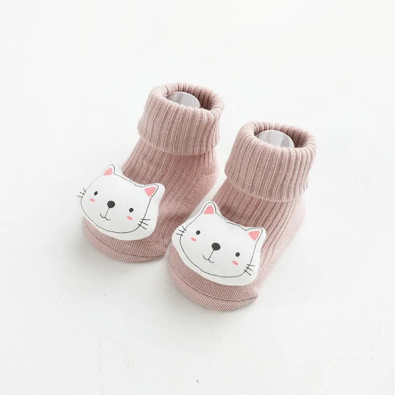 Baby socks with anti-slip glue dots on soles in combed cotton, showing mid-tube height and various colour options
