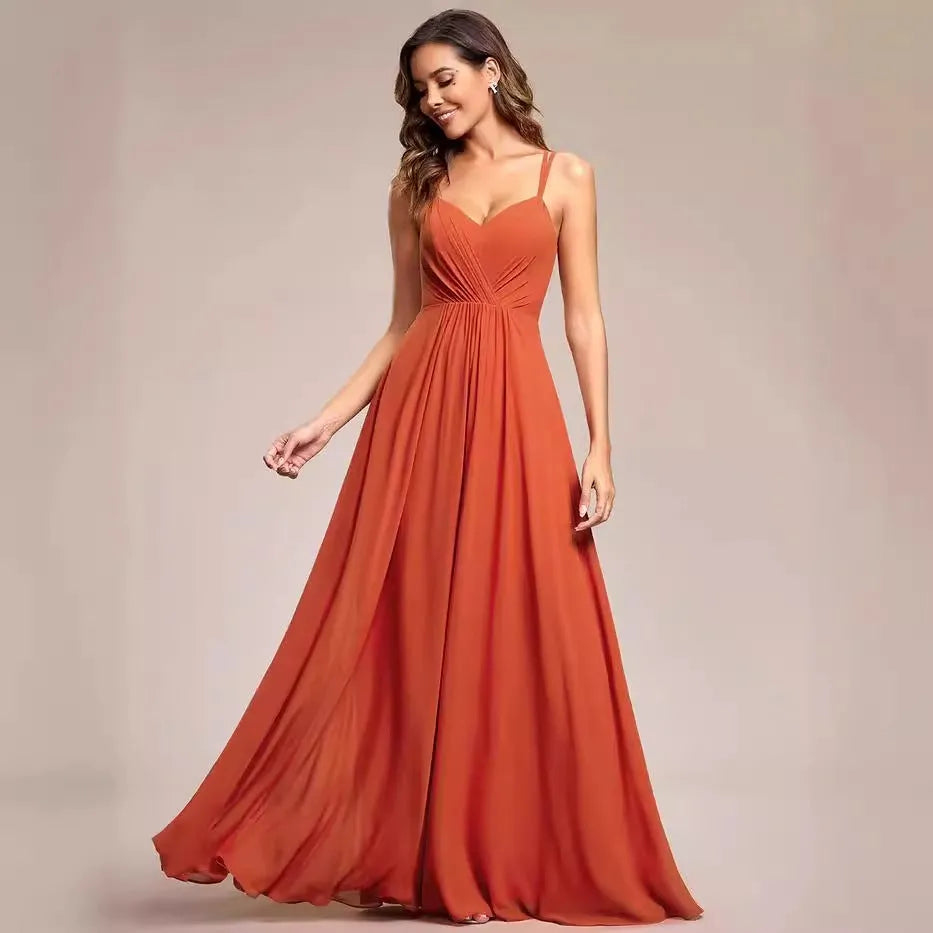 Women's sleeveless long dress with pleated detail and an A-line skirt in a light green colour.