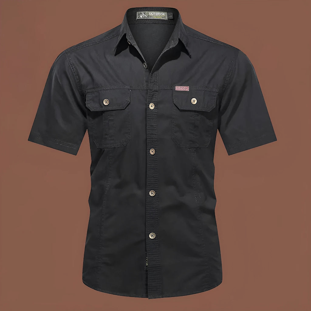 Man wearing a loose-fit army green short sleeve cotton work shirt with a cardigan style.