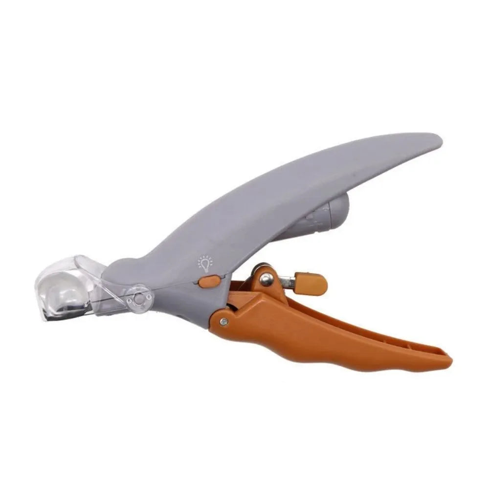 Yellow pet nail clipper with built-in LED light and magnifying glass for dog and cat grooming.