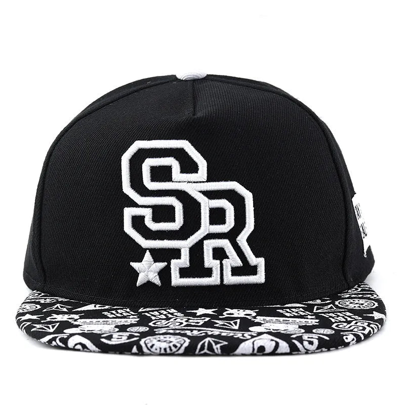 Cotton baseball cap with embroidered letters in black or white, showing adjustable strap and dome crown.
