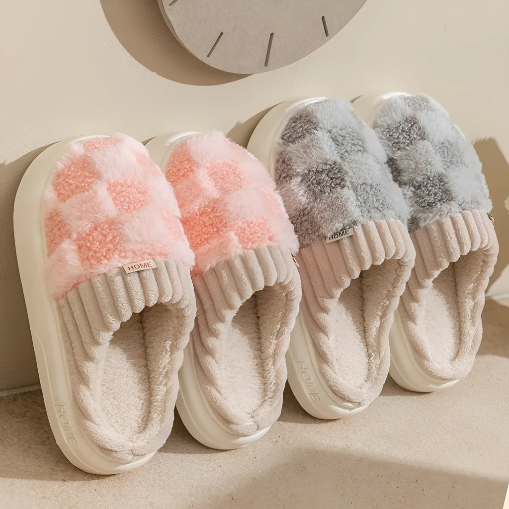 Women's plaid plush slippers in coffee colour with a soft upper, plush lining, and textured PVC sole.