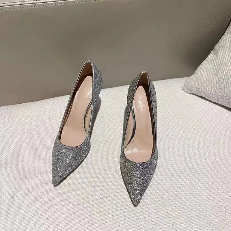 Silver and black women's wedding shoes with crystal detail and stiletto heel.