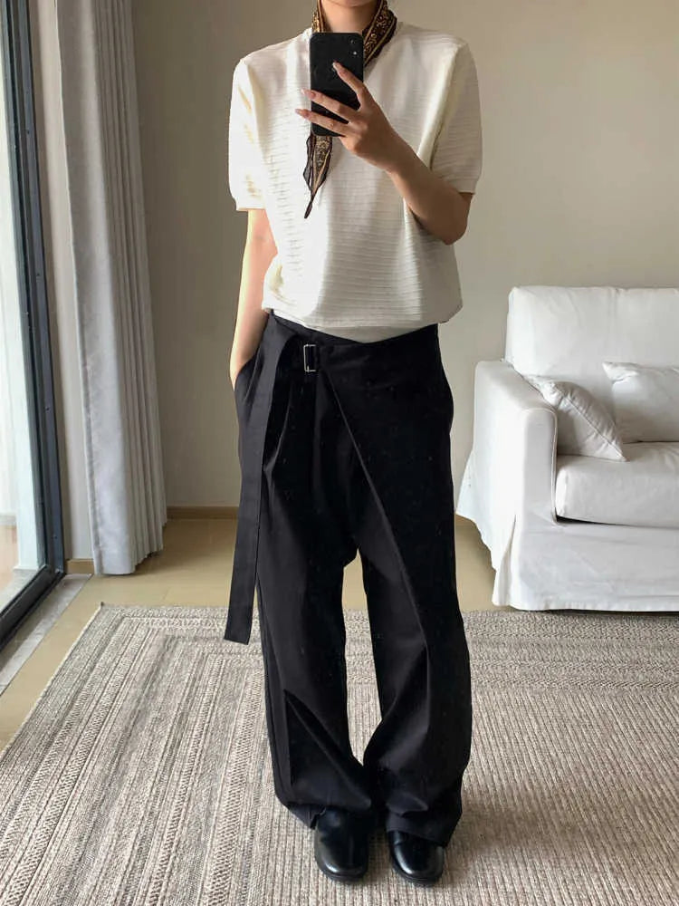 Black straight-leg trousers with a single pleat and adjustable waistband on a hanger.
