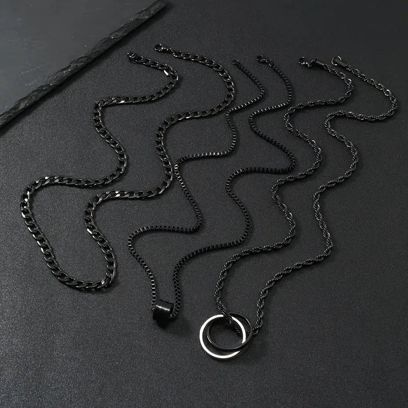 Men's black titanium steel ring buckle necklace set with three matching geometric stainless steel chains.