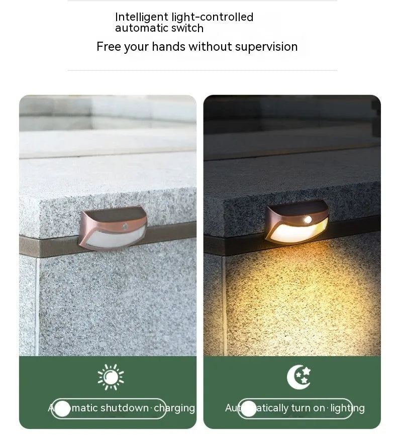 Solar outdoor wall lamp with smiling face design for garden decorative lighting