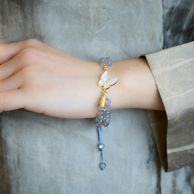 Gray moonstone bracelet with butterfly woven rope design and geometric retro styling