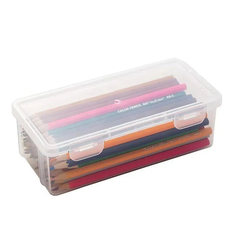 Clear plastic stationery storage box filled with assorted coloured pencils and crayons.