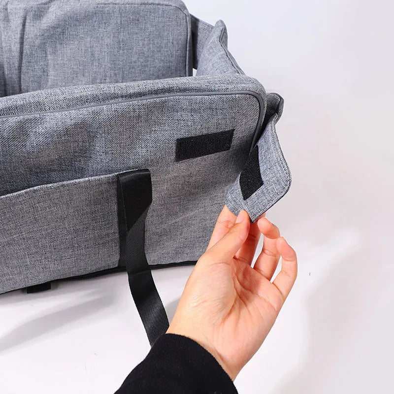 A portable grey cloth dog kennel with sponge insulation, suitable for outdoor and car use.
