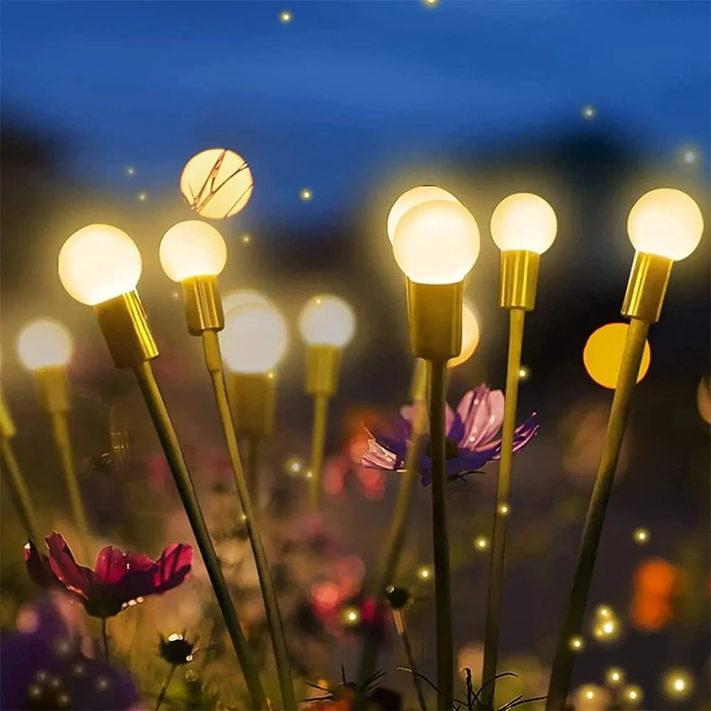 Solar-powered LED garden light with multiple heads on stainless steel ground spikes