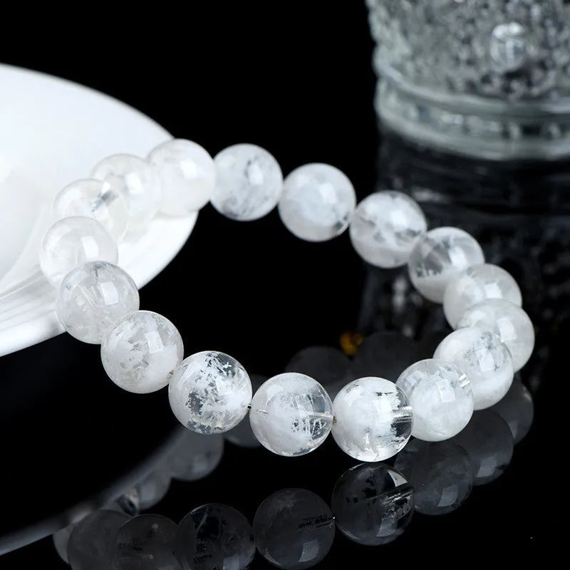 Crystal women's bracelet with natural blizzard snowflake round beads in geometric shapes with traditional decorative elements