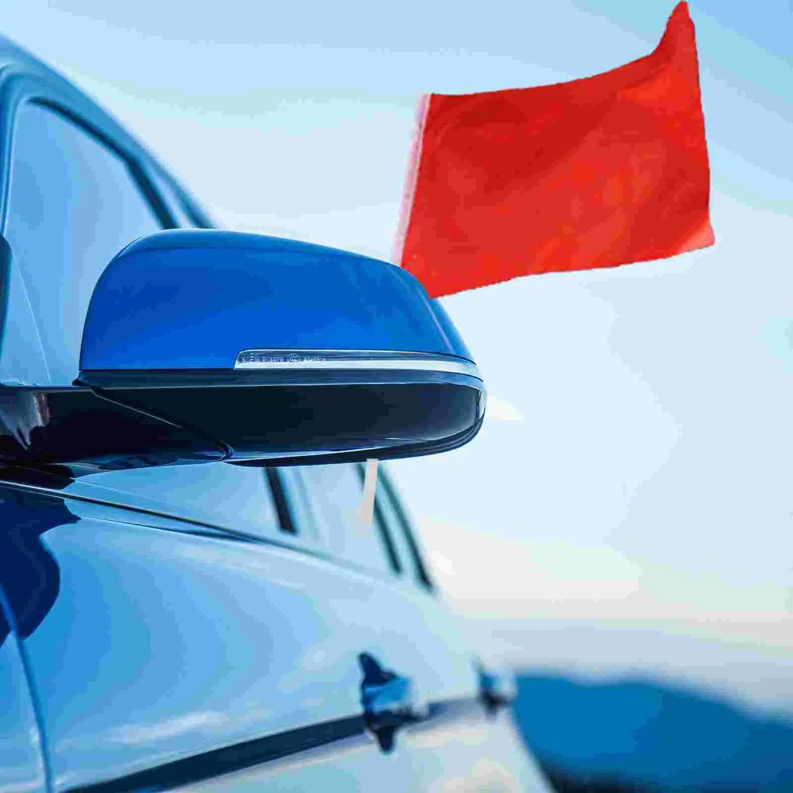 Ten white plastic car window flag pole clip mounts laid out on a surface.