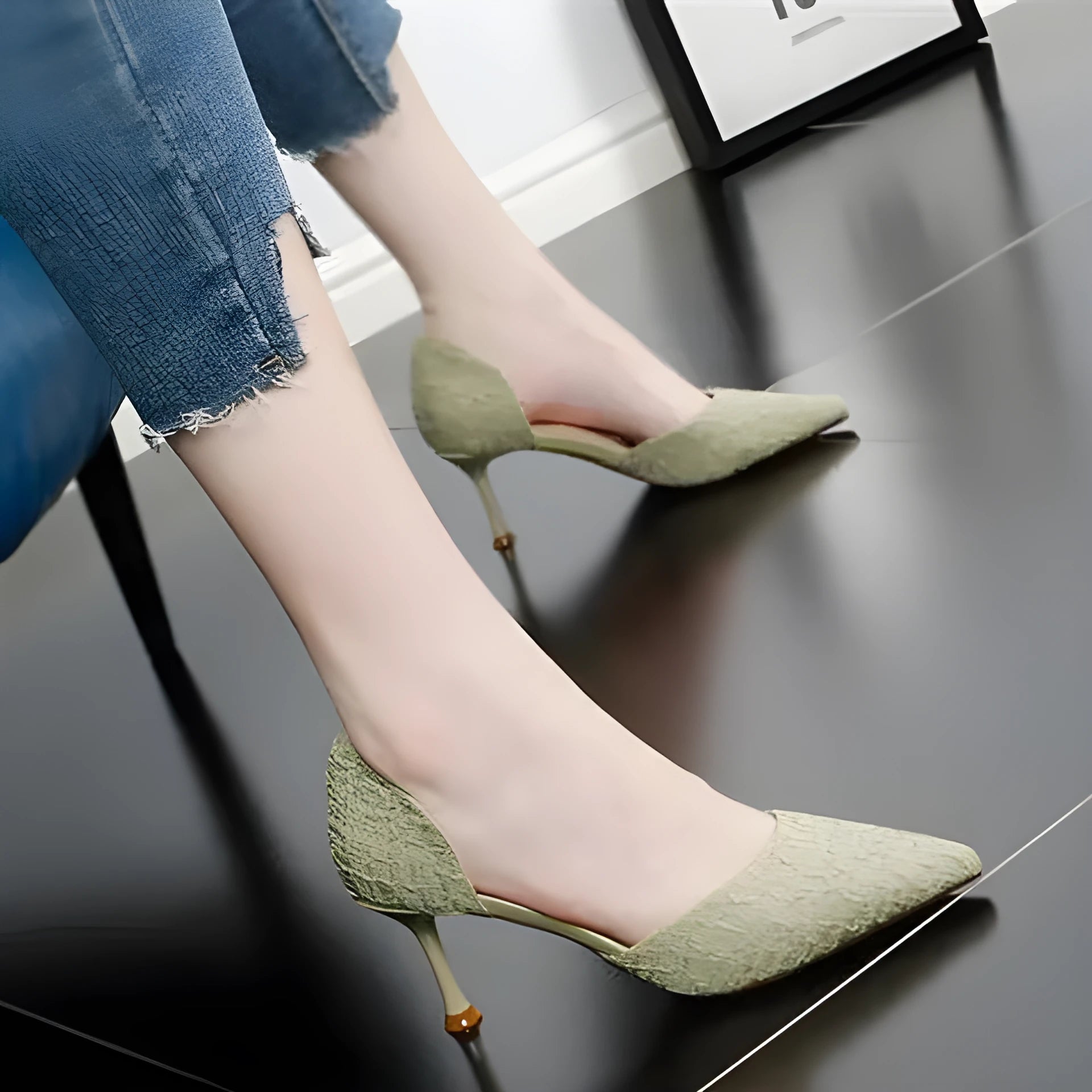 Women's black pointed toe stiletto high heel shoes with a 6-8cm heel on a rubber sole.