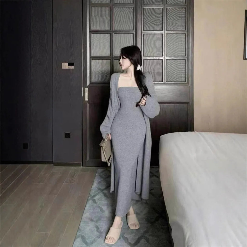 Women's grey knitted cardigan and long skirt two-piece set with flocking detail.