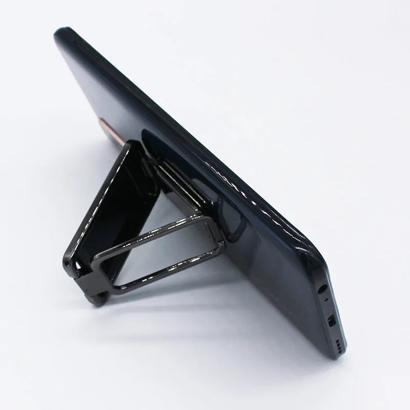 Silver foldable mobile phone holder with magnetic bracket showing adjustable viewing angles
