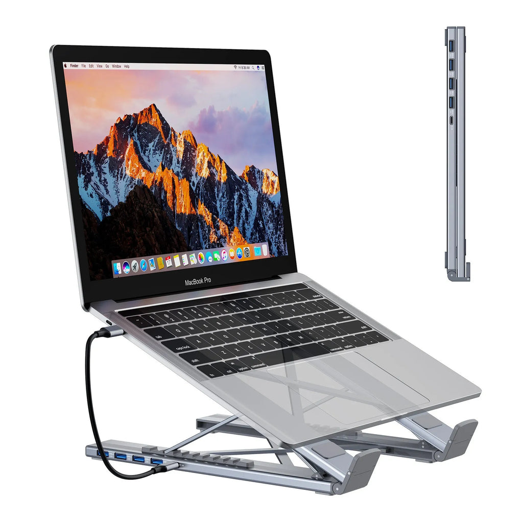 Aluminium folding laptop docking station stand with multi-port hub and HDMI output on a desk