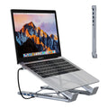 Aluminium folding laptop docking station stand with multi-port hub and HDMI output on a desk