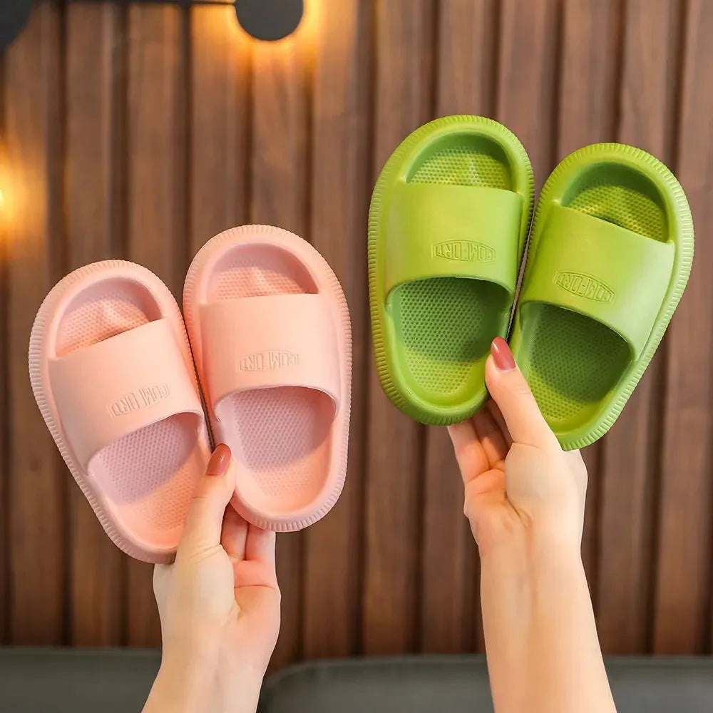 Children's colourful EVA slippers with a textured non-slip sole, shown in a mixed colour selection.