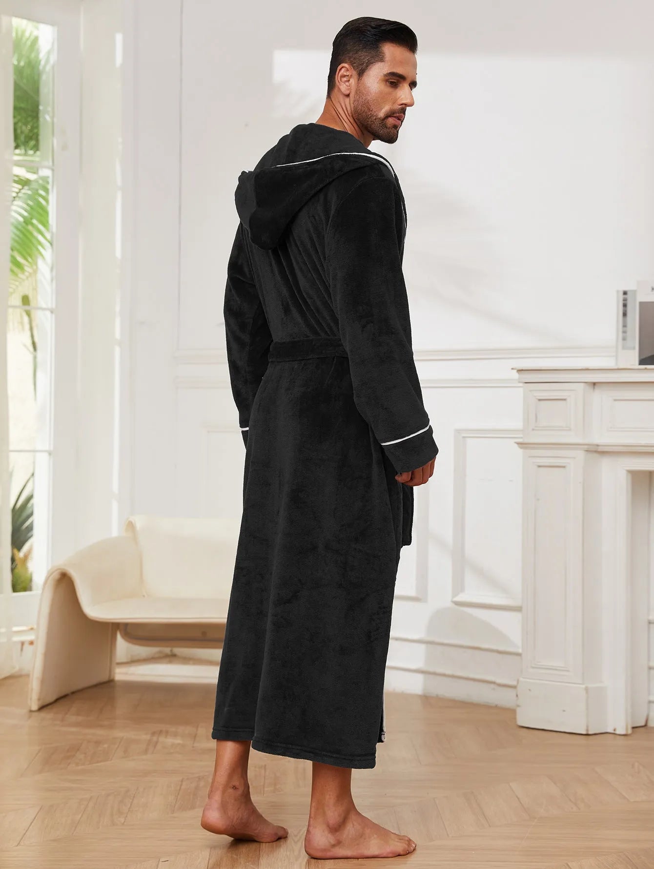 Man in a grey flannel bathrobe, European style, for winter home wear.