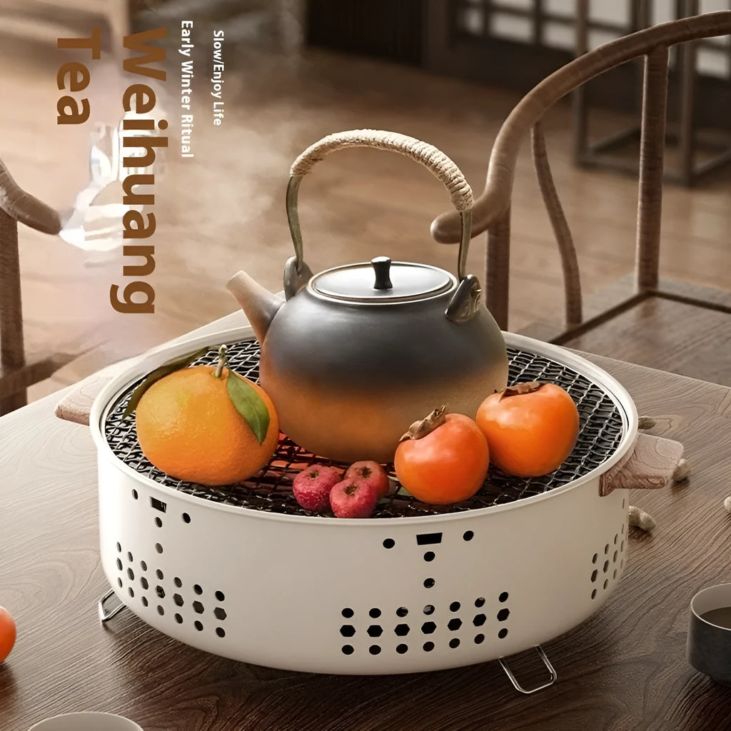 Portable indoor charcoal stove with grill rack disk for baking and tea cooking.